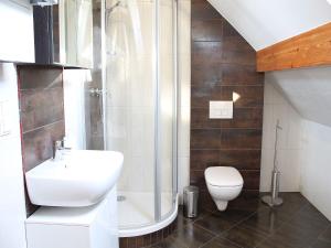 a bathroom with a shower and a sink and a toilet at Vanilla Apartment 3 in Krakow