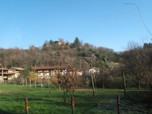 a house on top of a hill in a field at Bed & Breakfast Varionda in Chiaverano