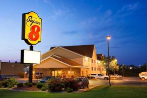 a sign for a super restaurant in a parking lot at Super 8 by Wyndham Alton in Alton