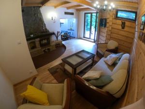 an overhead view of a living room in a log cabin at Gwiezdna 5 in Tresna
