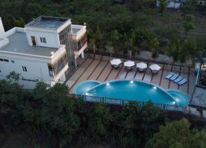 an overhead view of a resort with a swimming pool at The Competent Palace Hotel in Jhājra