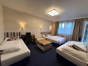 Postel nebo postele na pokoji v ubytování Hotel Austria
