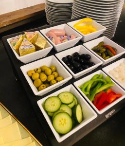 a table with white containers of different types of vegetables at Köln 2020 in Cologne