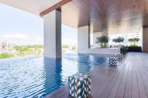 a swimming pool with a view of the water at KL Sentral Loft , EST Bangsar #2, LRT in Kuala Lumpur