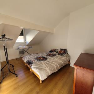 Posteľ alebo postele v izbe v ubytovaní Appart95 Saint-Brice CDG France