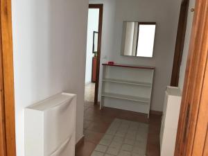 a bathroom with a sink and a mirror at Casa Vacanze in Santa Maria di Castellabate