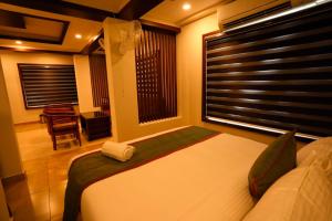 Zubis Inn Hotel客房内的一张或多张床位