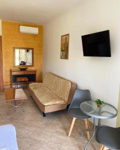 a living room with a couch and a table at Guesthouse Anestis in Angistron