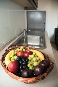 a basket of fruit on a counter in a kitchen at Anna's House in Kastoria