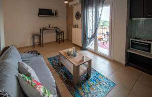 a living room with a couch and a coffee table at Anna's House in Kastoria
