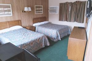 Katil atau katil-katil dalam bilik di Blue Way Inn & Suites Winfield