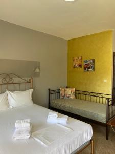a bedroom with two beds with towels on them at Guesthouse Anestis in Angistron