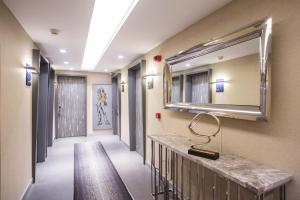 Postel nebo postele na pokoji v ubytování Zeniva Hotel