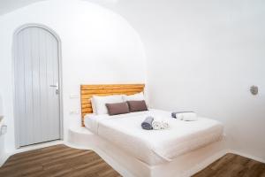 Łóżko lub łóżka w pokoju w obiekcie Karpimo Suites