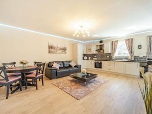 a living room with a couch and a table at Squirrel Cottage - Uk37886 in Stanhope