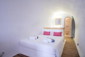 Łóżko lub łóżka w pokoju w obiekcie Karpimo Suites