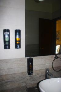 a bathroom with a sink and a mirror at Le Jardin Resort and Spa in Karjat