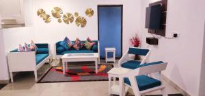 a living room with a couch and two chairs at Siolim 6bhk Private Villa with Private Pool close to Anjuna Vagator in Siolim
