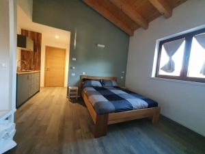 Cama ou camas em um quarto em Agriturismo Budin