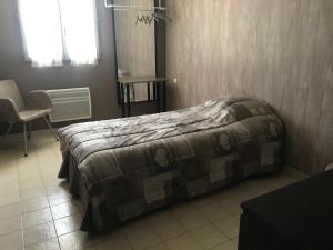 Postel nebo postele na pokoji v ubytování Chambre d'hôte " Le Ponant "
