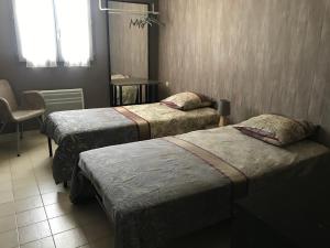Postel nebo postele na pokoji v ubytování Chambre d'hôte " Le Ponant "