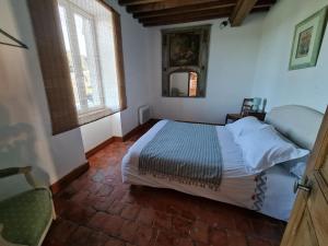 Posteľ alebo postele v izbe v ubytovaní Gîte des Tannières