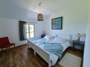 Posteľ alebo postele v izbe v ubytovaní Gîte des Tannières