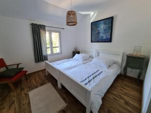 Posteľ alebo postele v izbe v ubytovaní Gîte des Tannières