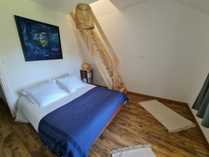 Posteľ alebo postele v izbe v ubytovaní Gîte des Tannières