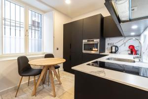 Kuchyňa alebo kuchynka v ubytovaní Allo Apartments San Roque Bajo A