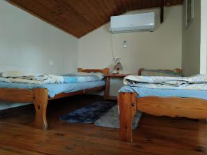a room with two beds in a room with a ceiling at beit nofesh waiss in Bet Hillel +26 photos