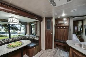 a kitchen and living room in a rv at Heartland North Trail 31' RV in Manchaca