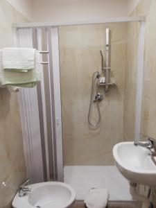 a bathroom with a shower and a toilet and a sink at Bnb Simy2 in Naples