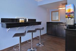 
a kitchen with two chairs and a counter top at Americas Best Value Inn Hollywood in Los Angeles
