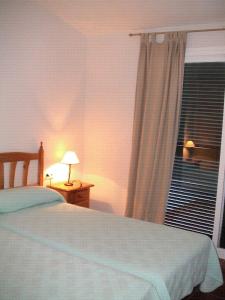 Ένα ή περισσότερα κρεβάτια σε δωμάτιο στο Via de Jardin 10 casa 20 +4 φωτογραφίες