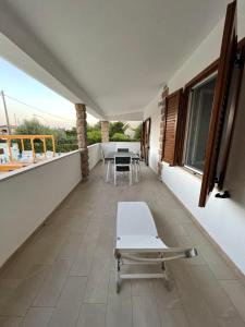 a balcony with a table and chairs on it at Casa Miele in Santa Lucia