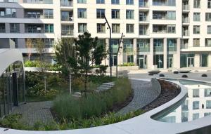 a courtyard in front of a large building at Prime Plac Unii in Gdynia