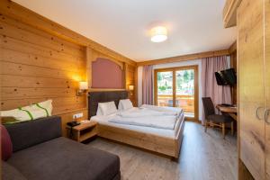 Rúm í herbergi á Hotel Kitzspitz