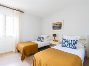 Posteľ alebo postele v izbe v ubytovaní Beachfront San Agustin Papagayos II