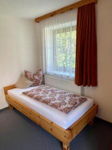 Łóżko lub łóżka w pokoju w obiekcie Ferienwohnung Rauch