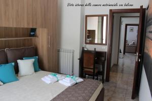 Postel nebo postele na pokoji v ubytování GUEST HOUSE ZIO MICHELE - CINISI