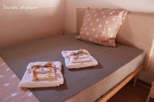 Postel nebo postele na pokoji v ubytování GUEST HOUSE ZIO MICHELE - CINISI