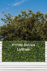a hedge with the words prime suites hyuana at Prime Suites Lytham in Lytham St Annes