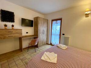 Postel nebo postele na pokoji v ubytování 4Flats in Orto di Venanzio