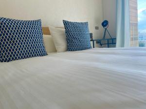 Llit o llits en una habitació de Appartement confortable et ensoleillé, belle vue