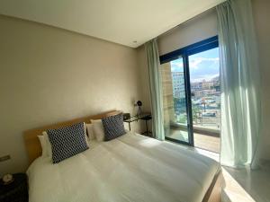 Posteľ alebo postele v izbe v ubytovaní Luxueux Appartement avec Vue Panoramique, Proche de la Gare WELCOME STAY