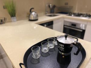 Kuchyňa alebo kuchynka v ubytovaní Luxueux Appartement avec Vue Panoramique, Proche de la Gare WELCOME STAY