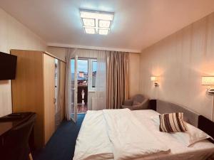 Postel nebo postele na pokoji v ubytování Hotel Austria