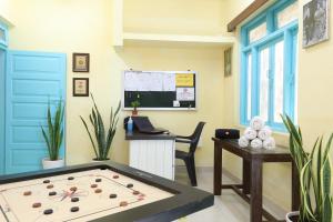 an office with a large billiard table in a room at Teles Westend Hotel in Marmagao