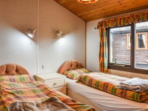 En eller flere senge i et værelse på 27 Aviemore Holiday Park